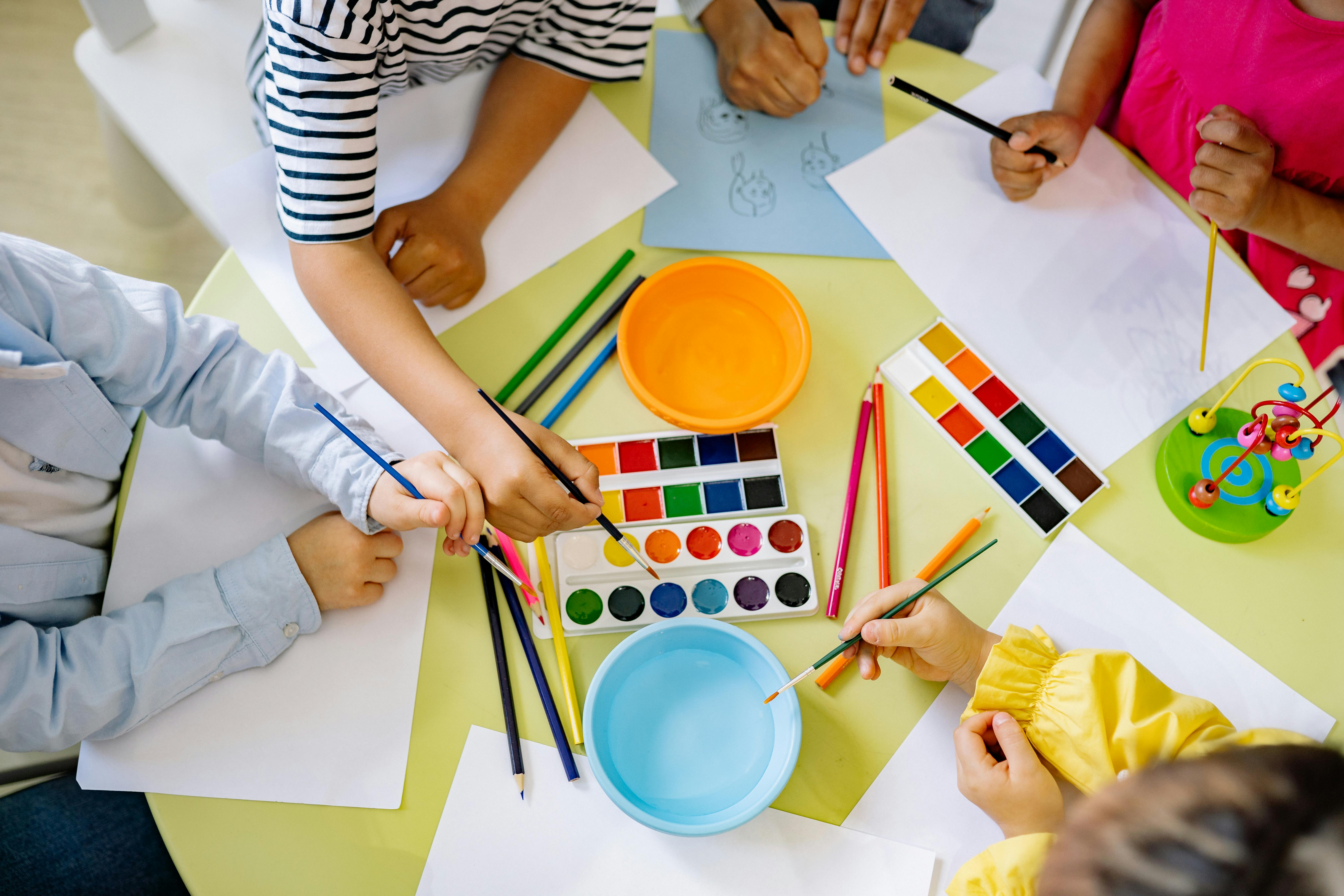 Children painting on table