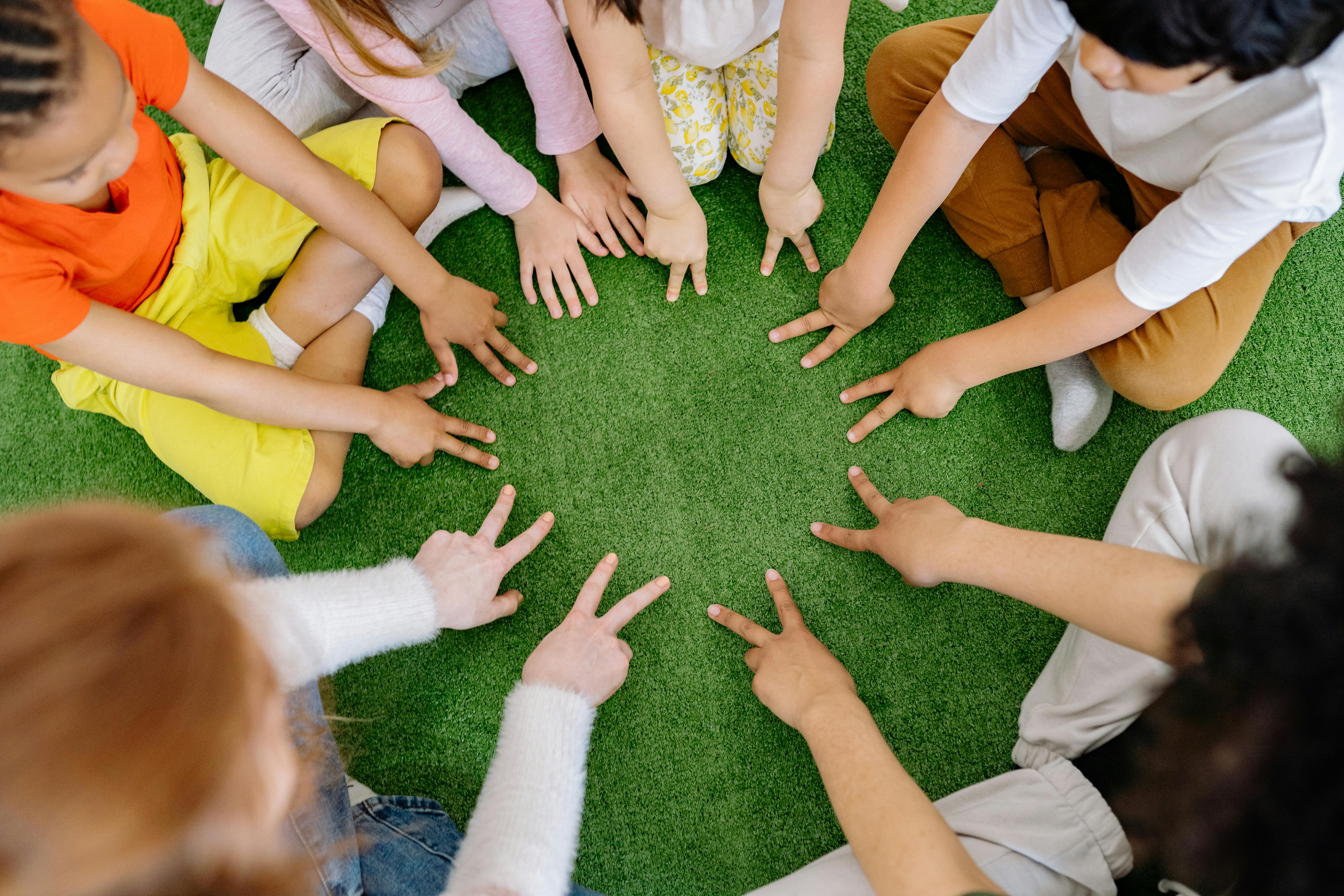 Children making stars with fingers