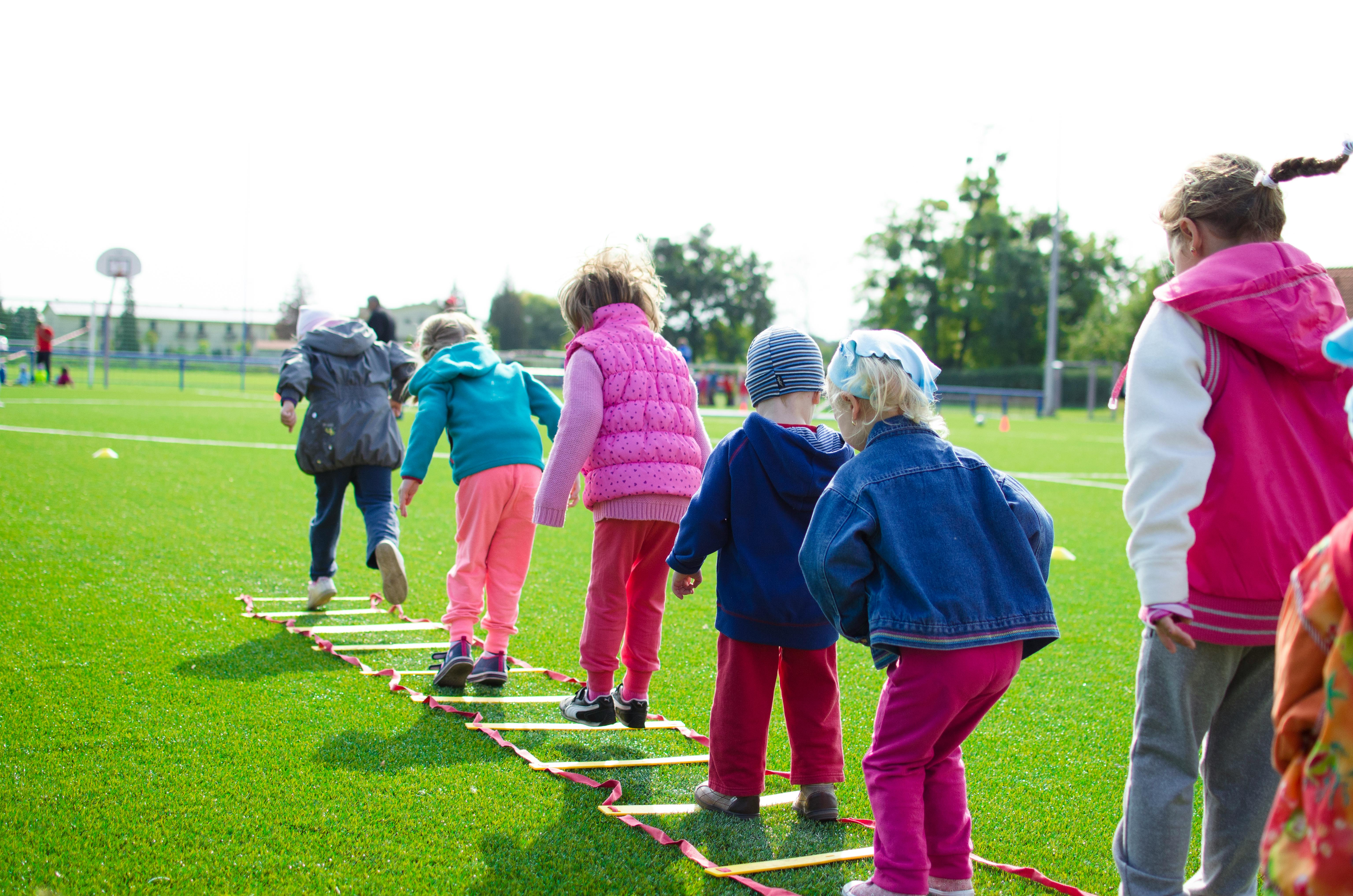 Children playing ladders outside